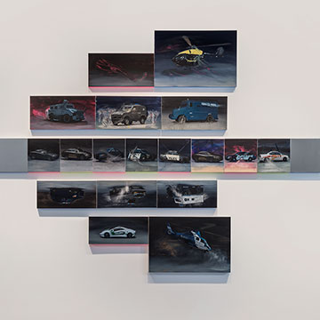 A collection of paintings depicting various vehicles on different sized panels